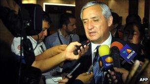 Otto Perez Molina talks to journalists on 12 September