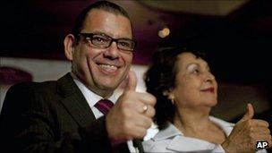 Manuel Baldizon (left) gives the thumbs up during a news conference on 12 September