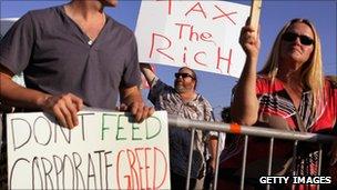 Protesters outside the venue of the Republican debate in Tampa on 12 September 2011