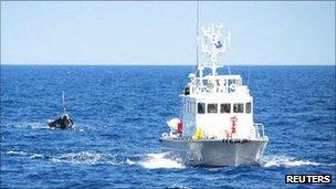 Japanese Coast Guard tows the vessel to port on 13 September 2011