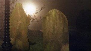 Headstones at night