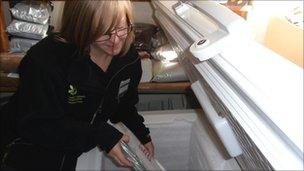 House steward Kathryn Croxford with one of the damaged books