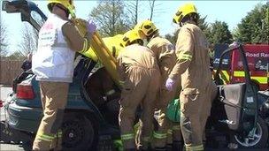 Firemen taking part in road safety drill