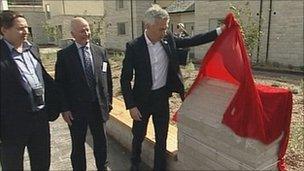 Gold medal Olympian Jonathan Edwards unveiling a plaque at the 2012 Olympic village in Dorset