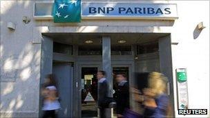 People walking past BNP Paribas