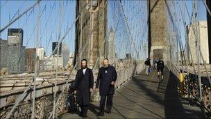 Orthodox Jews cross the Brooklyn Bridge