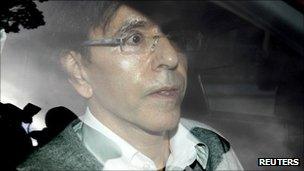 Belgian government broker Elio Di Rupo arrives in a car for talks in Brussels, 14 September