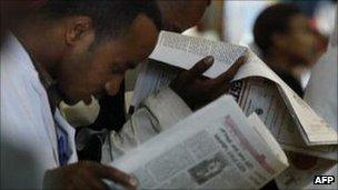 People reading newspapers in Ethiopia (Archive shot 2005)