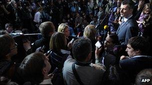 Russian billionaire Mikhail Prokhorov (right) speaks to journalists in Moscow, 15 September
