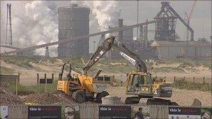 Diggers working on Redcar's new pier