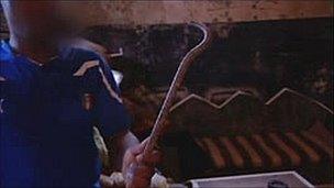 Alleged victim shows instrument apparently used by attackers