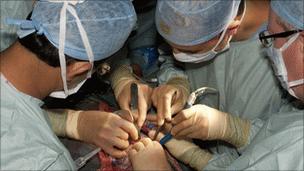 Surgeons operating