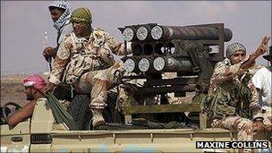 Anti-Gaddafi forces sitting in a truck