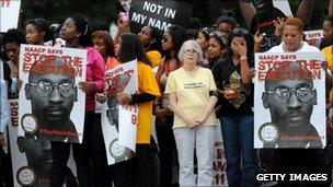 Protesters holding signs for Troy Davis