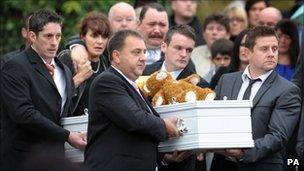 Harry Patterson's parents Christian and Michelle (centre rear), walk behind his coffin, outside St John's Church in Alltwen, Pontardawe, before his funeral