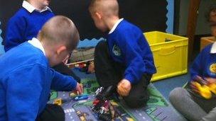 Four pupils taking part in an activity at Baguley Hall Primary School