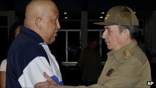 Cuban President Raul Castro embraces Hugo Chavez of Venezuela