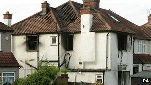 The house damaged by the fire which killed six members of the same family