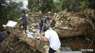 Police inspect the crash site in Lalitpur, Nepal (25 Sept 2011)