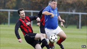 Ed Balls playing football with journalists