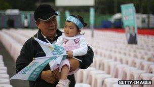 Taiwanese man holding child