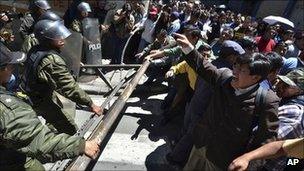 Protesters clash with police officers in La Paz, Bolivia on Monday