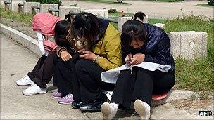 Girls in Pyongyang texting