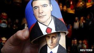 Traditional Matryoshka doll bearing the faces of Russian Prime Minister Vladimir Putin (underneath) and President Dmitry Medvedev