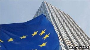 An EU flag flutters outside the European Central Bank in Frankfurt, Germany, 27 September