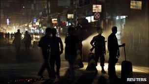 Police stand guard in Kathmandu at a rally by a Maoist faction opposed to giving up the former rebels' weapons, on September 2, 2011