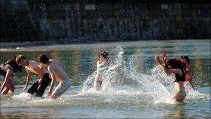 Teenagers in the sea at Cullercoats, North Tyneside