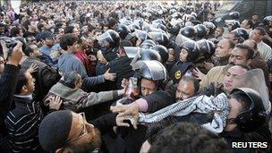 Anti-government protesters clash with police in Cairo on 25 Jan, demanding an end to Hosni Mubarak's 30-year rule