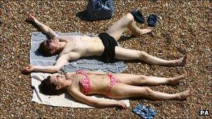 A couple sunbathing