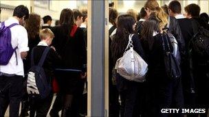 Students walking in a school hallway