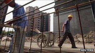 Workers on a residential construction site in Shanghai September 8, 2011