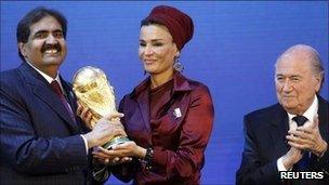 Qatar delegates celebrate after being awarded the 2022 World Cup hosting rights