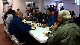 People eating at a food bank