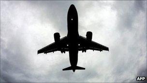 An airliner flying above Liverpool's John Lennon Airport (archive image)