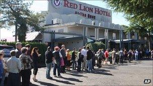 Job seekers line up outside a job fair in Washington state