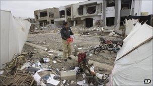 Policeman at the scene of a bombing in Karachi in September 2011