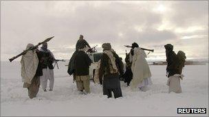 In this file picture released exclusively to Reuters, Taliban militants are seen with their weapons in an undisclosed location in Afghanistan on 16 January 2009.