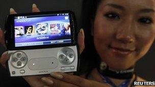 A model shows Sony Ericsson's Xperia PLAY phone