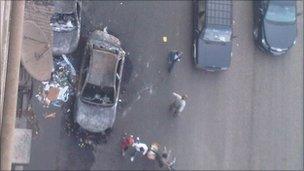 Burnt out car. Scene from Sandra's apartment