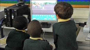 Children looking at computer