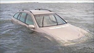 The car stranded on Holy Island causeway