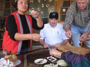 Alishan tribe member with tourists