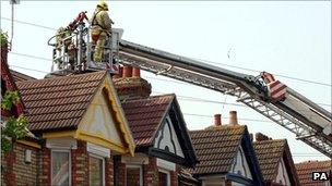 Fire service dealing with property damage