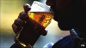 Man drinks a pint of lager in a London pub, file pic from 2007