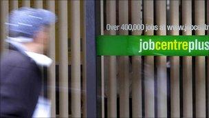 A person passing a Job Centre Plus