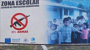 Sign identifying a school in Cauca